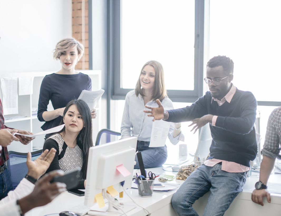 A diverse and dynamic group of people having a discussion.